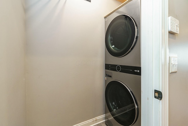 laundry area with stacked washer and clothes dryer