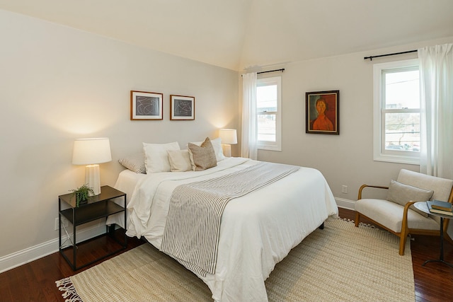 bedroom featuring vaulted ceiling and dark hardwood / wood-style floors