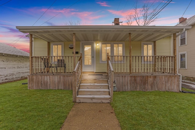 bungalow-style home featuring a yard and a porch