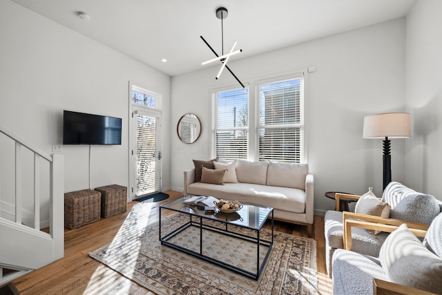 living room featuring a chandelier and hardwood / wood-style floors