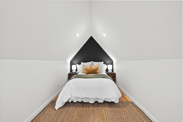 bedroom featuring lofted ceiling