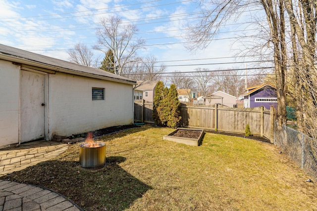 view of yard featuring a fenced backyard and a vegetable garden