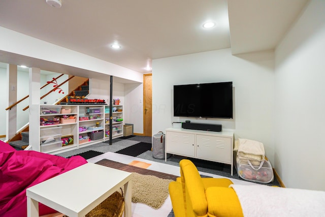 living area with baseboards, stairway, and recessed lighting