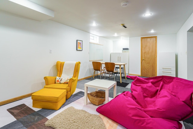 living room with baseboards and recessed lighting