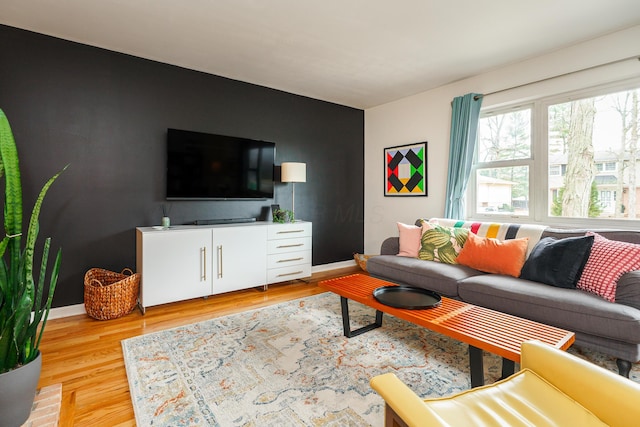 living room with wood finished floors and baseboards