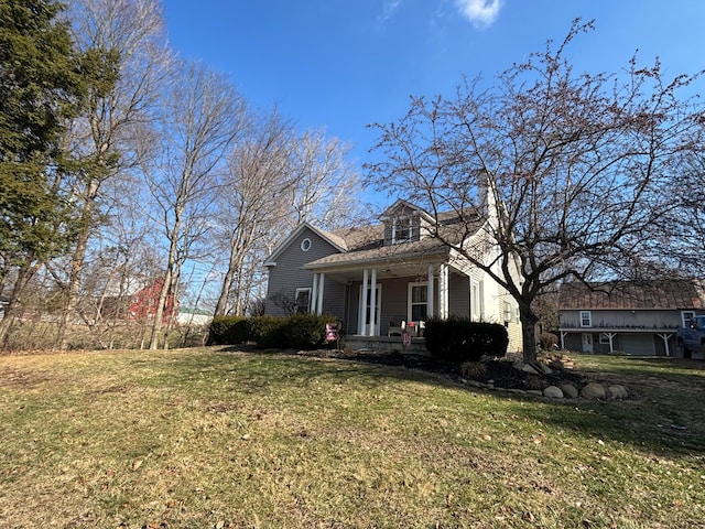 view of front of property with a porch and a front yard