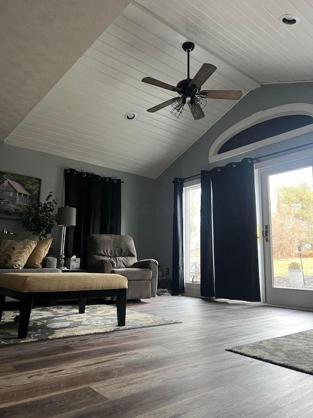 living area featuring wood ceiling, vaulted ceiling, and wood finished floors