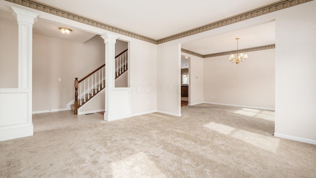 empty room featuring ornamental molding, light colored carpet, baseboards, and stairs