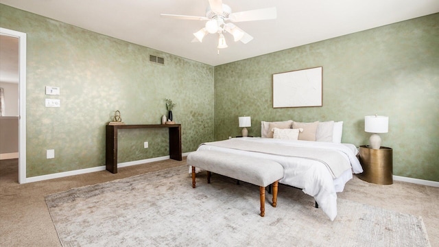 bedroom with ceiling fan, carpet flooring, visible vents, and baseboards