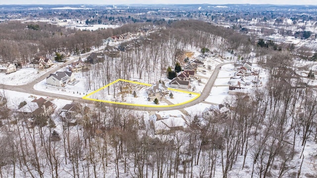 snowy aerial view featuring a residential view