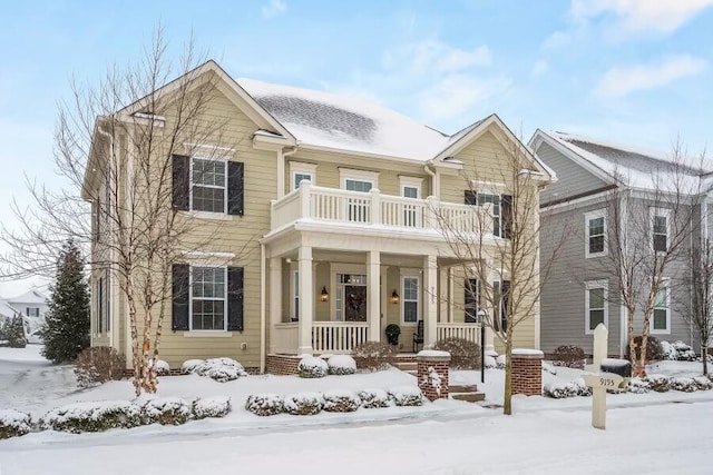 view of front of home with a porch and a balcony