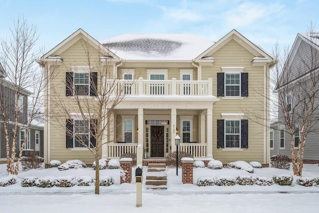 view of front of property with a balcony and covered porch