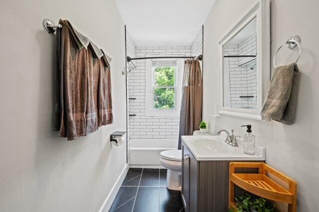 full bathroom featuring vanity, toilet, and shower / bath combo with shower curtain