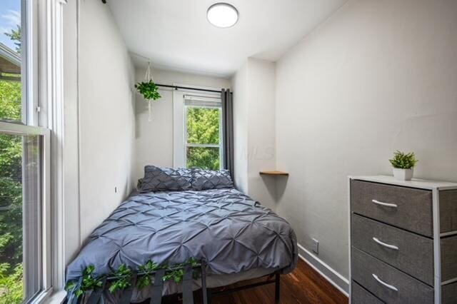 bedroom featuring dark hardwood / wood-style floors