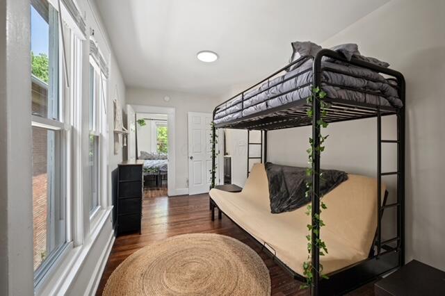 bedroom featuring dark hardwood / wood-style flooring