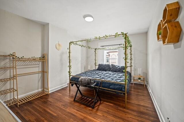 bedroom featuring dark wood-type flooring