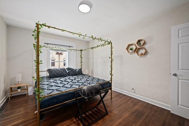 bedroom featuring dark wood-type flooring