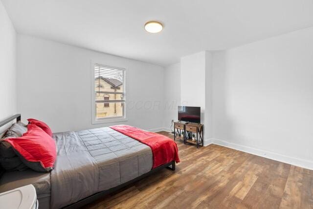 bedroom with wood-type flooring