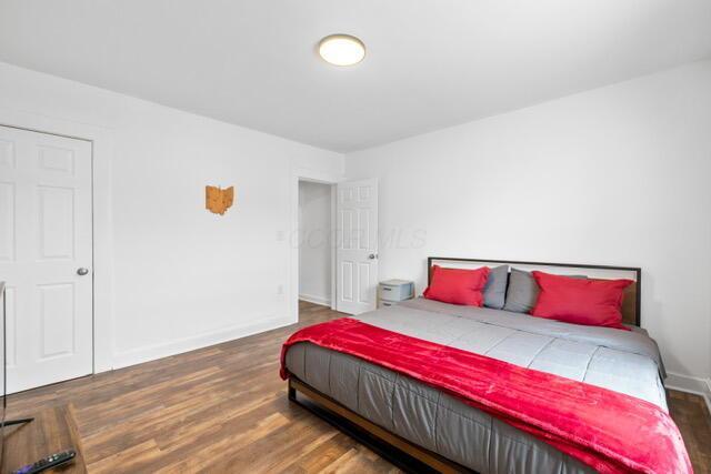 bedroom featuring dark hardwood / wood-style flooring