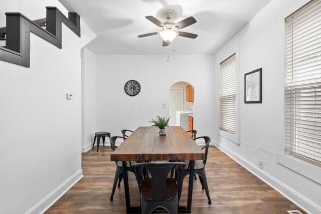 dining area with dark hardwood / wood-style floors and ceiling fan