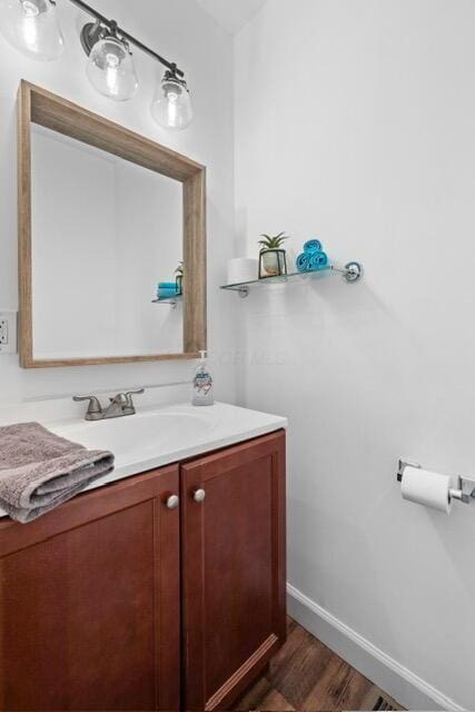 bathroom featuring vanity and hardwood / wood-style floors