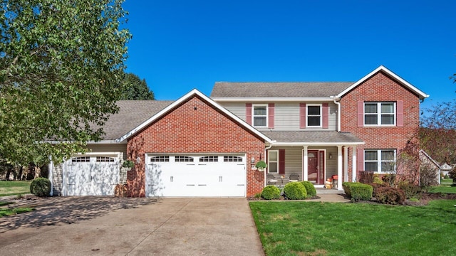 traditional-style home featuring a garage, driveway, a front lawn, and roof with shingles