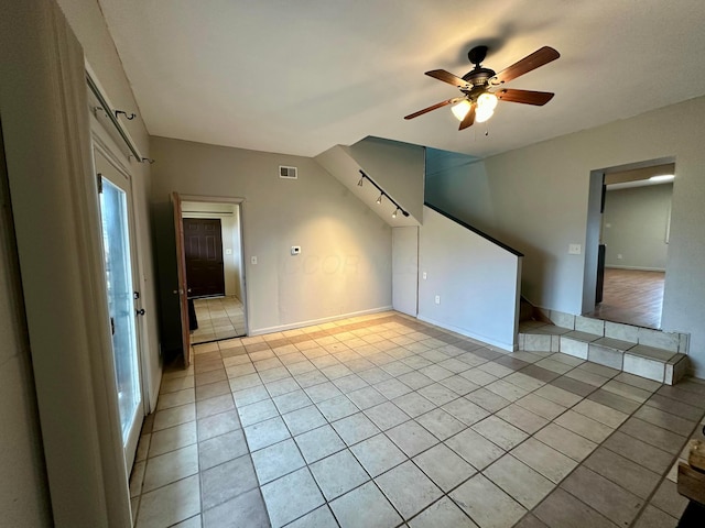 tiled empty room with ceiling fan