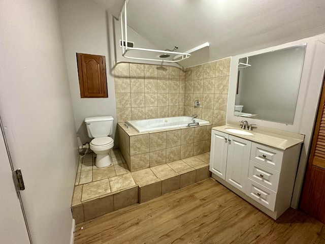 full bathroom featuring vanity, hardwood / wood-style floors, plus walk in shower, and toilet