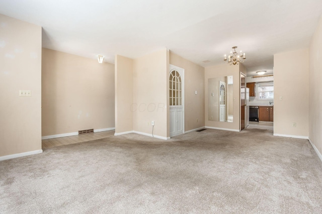 unfurnished living room with light carpet and a chandelier