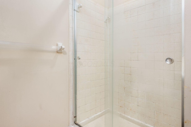 bathroom featuring an enclosed shower