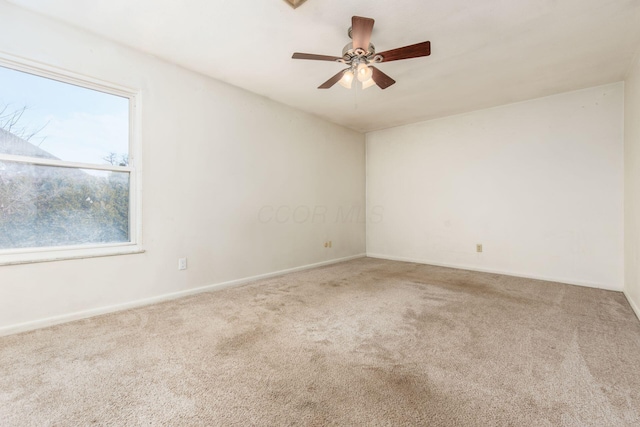 empty room with carpet floors and ceiling fan