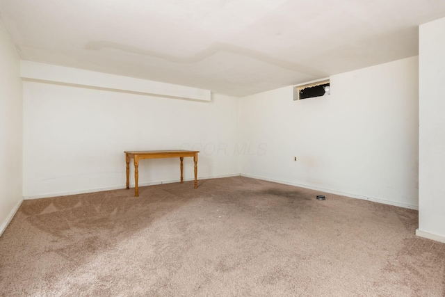 spare room featuring carpet flooring