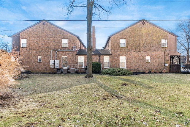 back of house with a yard