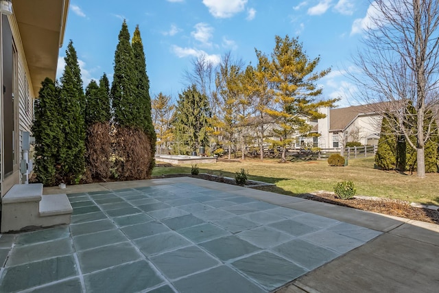 view of swimming pool with a yard and a patio