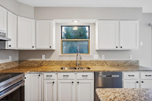 kitchen with appliances with stainless steel finishes, white cabinets, a sink, and under cabinet range hood