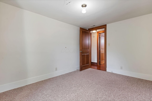 spare room featuring carpet floors