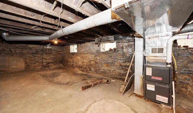 basement featuring heating unit