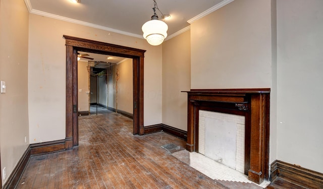 unfurnished living room with wood-type flooring and crown molding