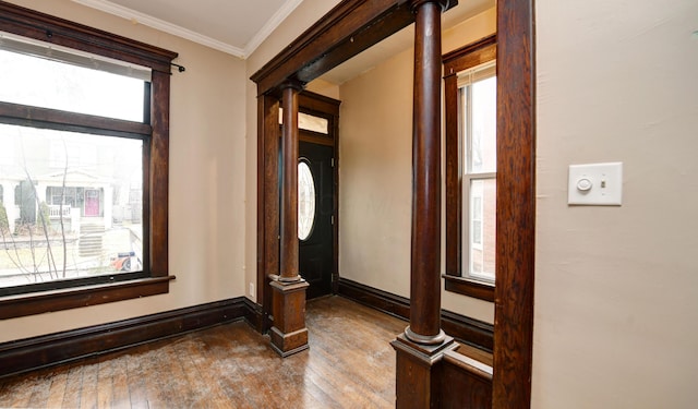 interior space featuring plenty of natural light and decorative columns