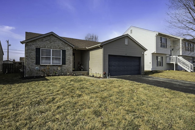 view of front of property featuring a garage and a front yard