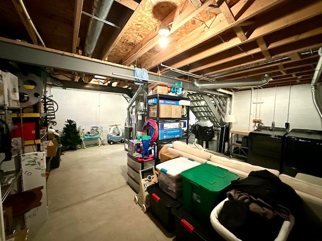 basement featuring washing machine and clothes dryer