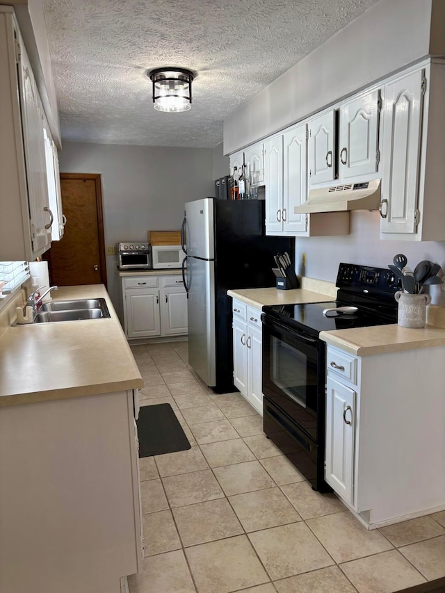 kitchen with light tile patterned flooring, black electric range oven, sink, white cabinetry, and a textured ceiling