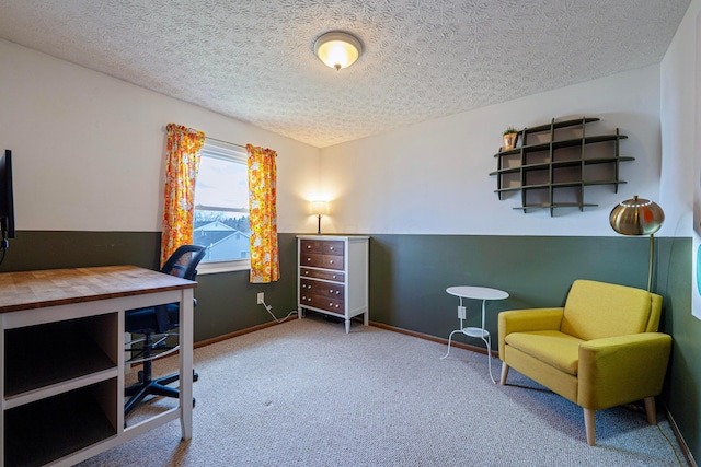 carpeted home office featuring a textured ceiling and baseboards