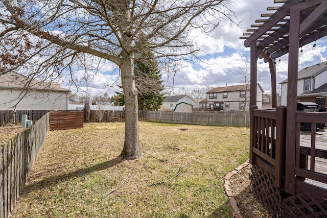 view of yard with a fenced backyard and a pergola