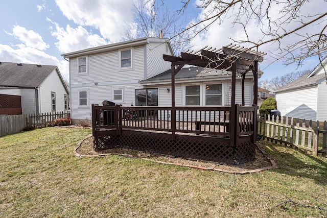 rear view of property featuring a fenced backyard, a yard, and a deck