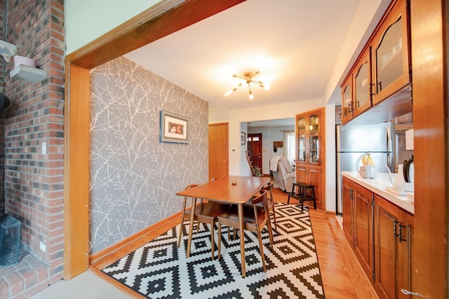 dining area with light hardwood / wood-style flooring