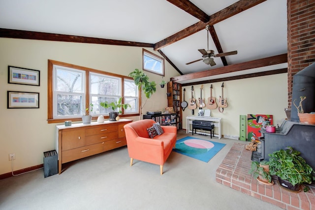 living area with vaulted ceiling with beams, light colored carpet, and ceiling fan