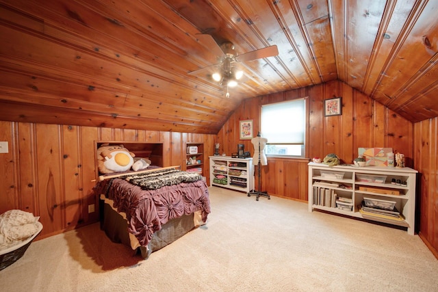 bedroom featuring carpet flooring, vaulted ceiling, wooden ceiling, and wood walls