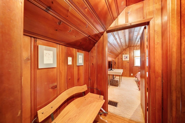 bathroom featuring lofted ceiling, wooden walls, and wood ceiling