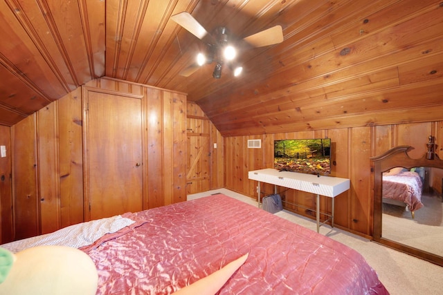 bedroom featuring lofted ceiling, wooden ceiling, light carpet, and wood walls